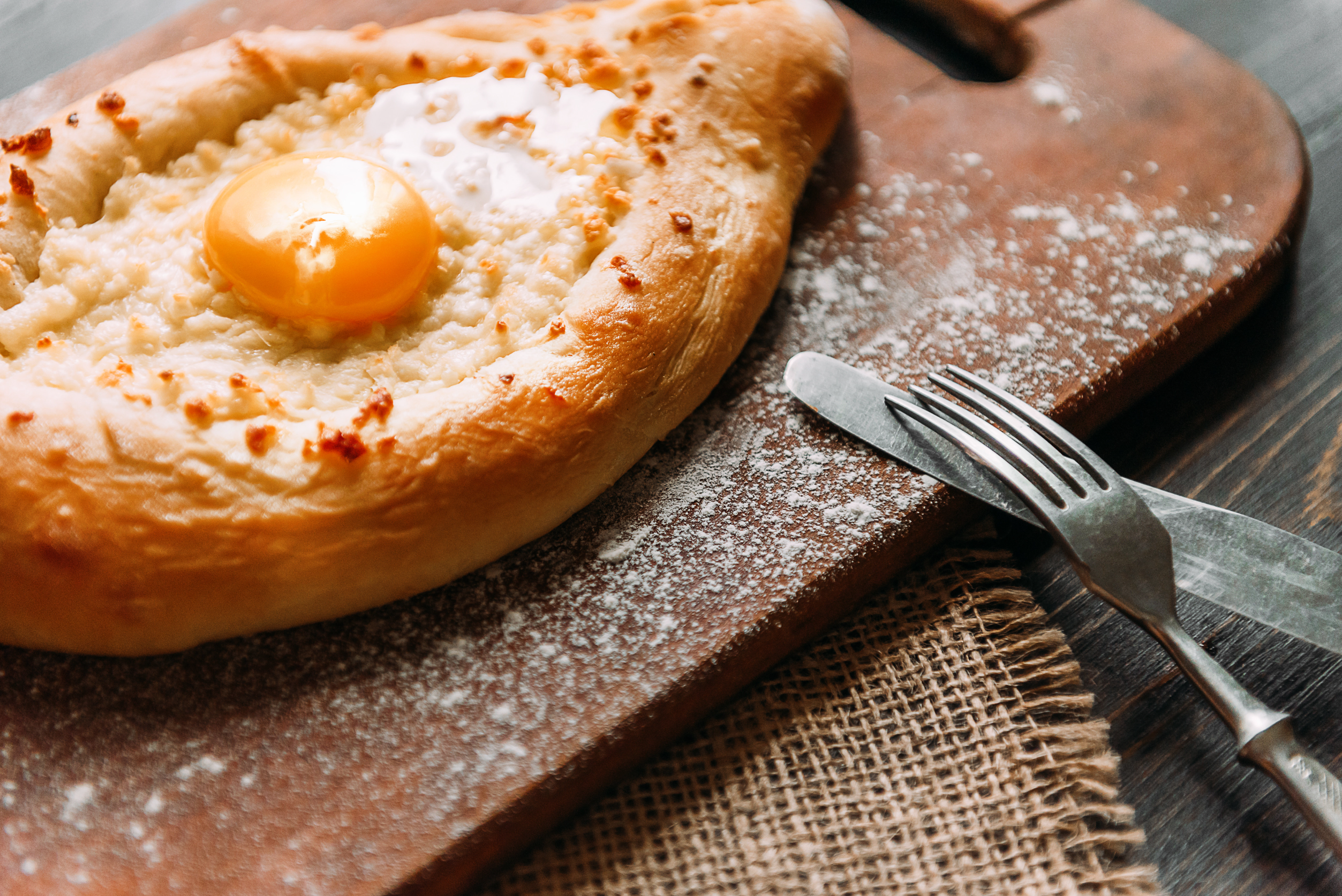 Directly above view of Khachapuri - traditional Georgian pastry with cheese and egg