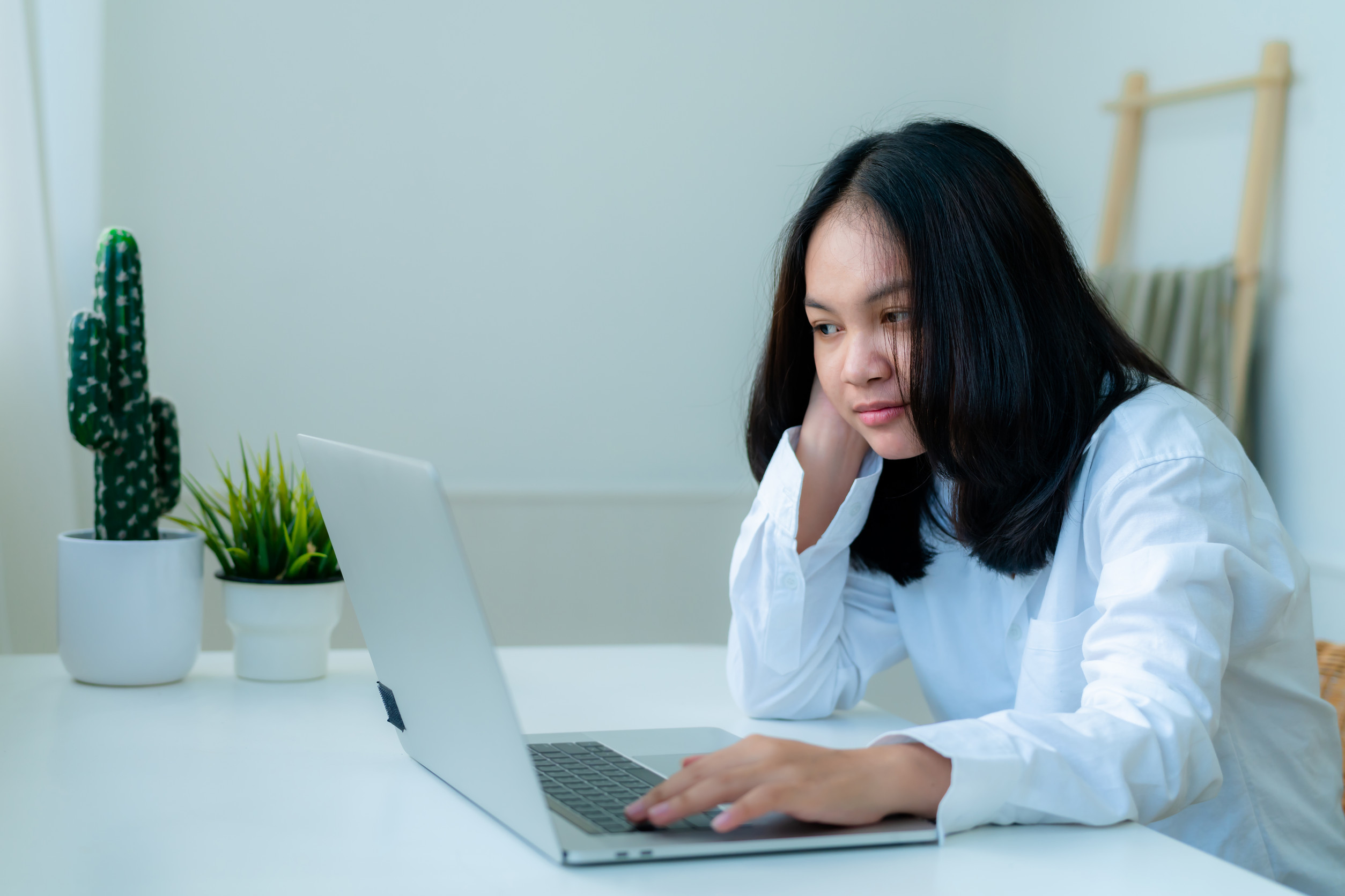 A Woman Using A Laptop