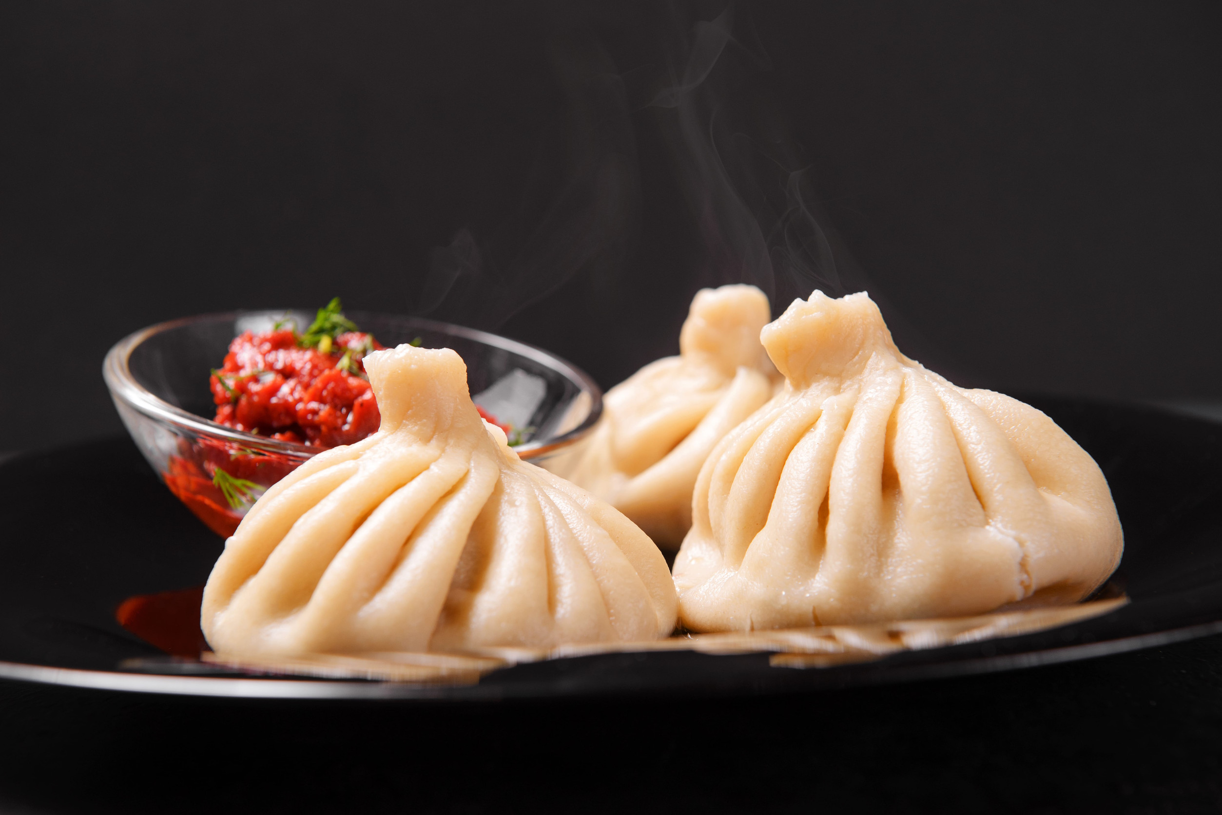 Freshly steamed Khinkali with sauce