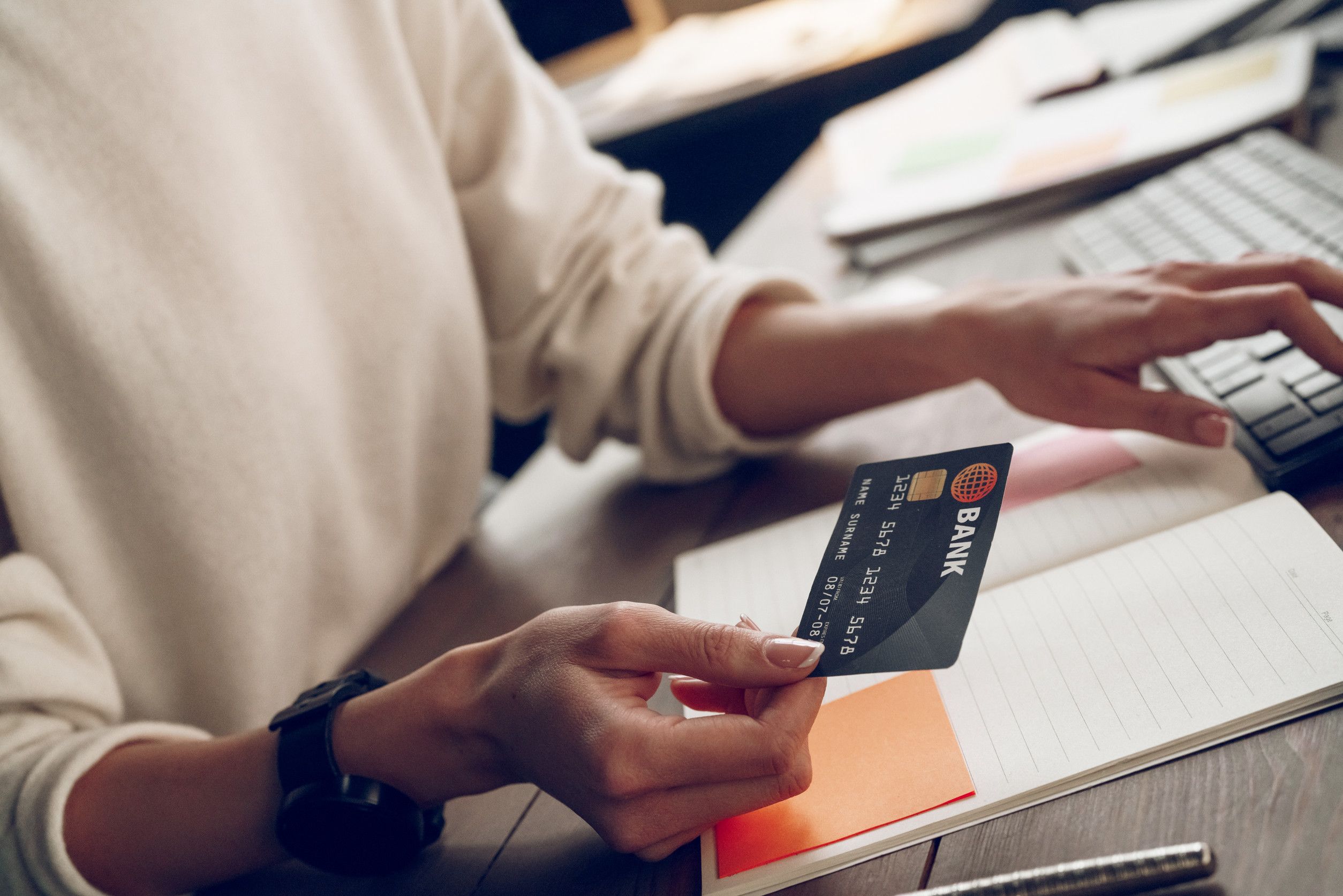 Woman holding best discount card, focus on bank and card