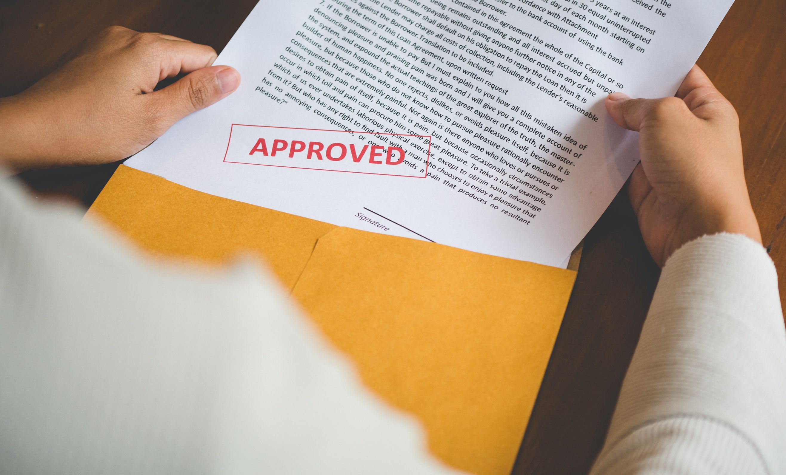 Women are opening an envelope document