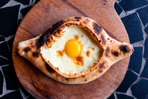 Directly above view of Khachapuri - traditional Georgian pastry with cheese and egg