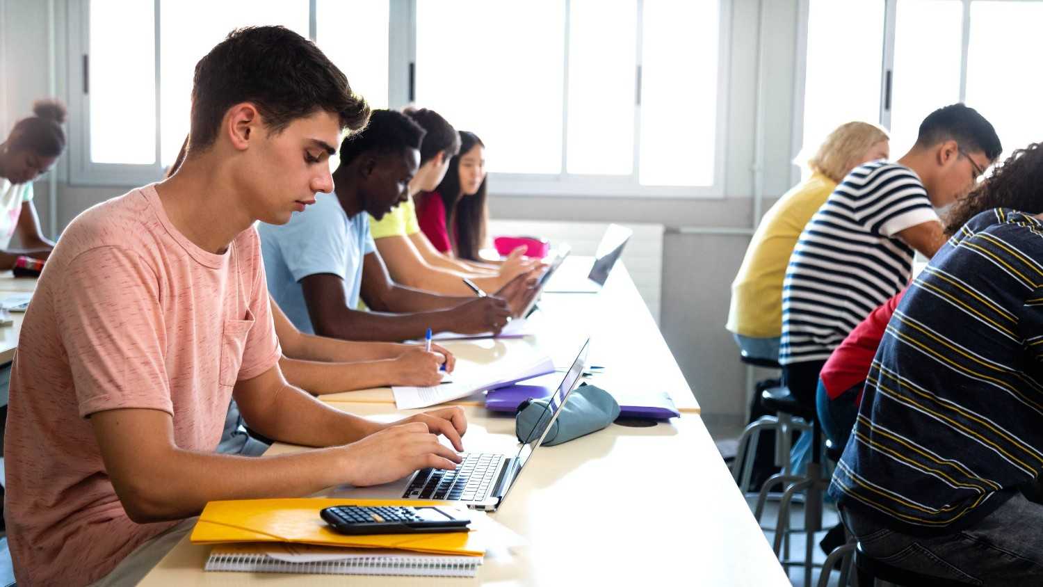 Student Studying In A Classroom